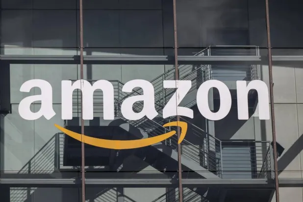 The Amazon logo can be seen at the administrative headquarters in Munich. Peter Kneffel/dpa 