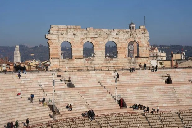 Visitors enjoy their tour at the Arena of Verona, Italy, Wednesday, Dec. 10, 2025. (AP Photo/Luca Bruno)