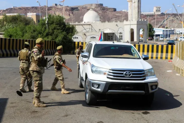  
Caption: Soldiers loyal to Yemen’s Southern Transitional Council inspect a truck outside the presidential palace complex in Aden (Reuters)