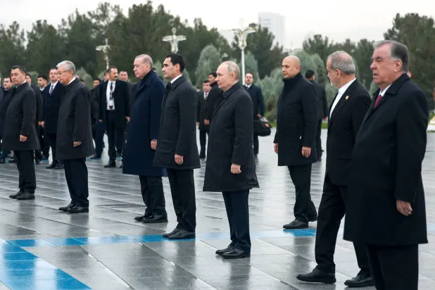 (R-L) Tajik President Emomali Rahmon, Iranian President Masoud Pezeshkian, Russian President Vladimir Putin, Turkmen President Serdar Berdimuhamedov, Turkish President Recep Tayyip Erdogan, Kazakh President Kassym-Jomart Tokayev, and Kyrgyz President Sadyr Japarov attend a wreath-laying ceremony at the Turkmenistan Neutrality Monument in Ashgabat, Turkmenistan, 12 December 2025. EPA/ALEXANDER SHCHERBAK / SPUTNIK / KREMLIN POOL MANDATORY CREDIT
