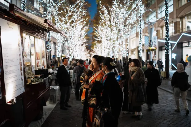People stroll along Marunouchi Naka-dori Street illuminated with winter lights Wednesday, Dec. 10, 2025, in Tokyo. (AP Photo/Eugene Hoshiko)