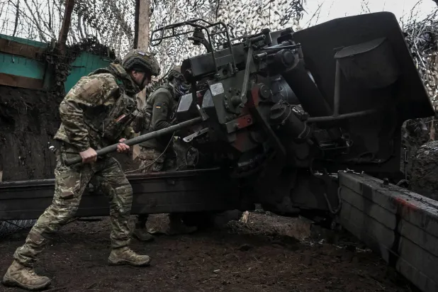  Artillerymen of the 152nd Separate Jaeger Brigade fire a howitzer towards Russian troops, amid Russia's attack on Ukraine, near the frontline town of Pokrovsk in Donetsk region, Ukraine December 11, 2025. (Reuters)