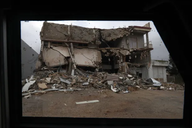 A destroyed house is seen from an armored vehicle of the United Nations Interim Force in Lebanon (UNIFIL) in the village of Blida, near the border with northern Israel, southern Lebanon, 08 December 2025. (EPA)