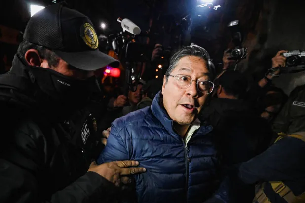 Former Bolivian President Luis Arce Catacora enters San Pedro prison after a judge ordered him held in pre-trial detention for five months as part of an investigation into alleged embezzlement, in La Paz, Bolivia, December 12, 2025. REUTERS/Claudia Morales