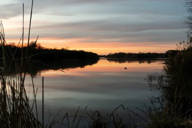 FILE PHOTO: The sun sets over the Rio Grande River in Salineno, Texas, US, February 18, 2025. REUTERS/Cheney Orr/File Photo