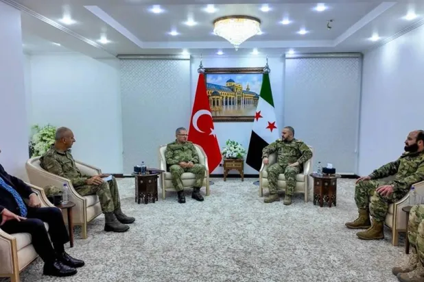 Turkish Land Forces Commander Metin Tokel and Syrian Defense Minister Murhaf Abu Qasra meet in Damascus on December 11. (Turkish Defense Ministry) 
