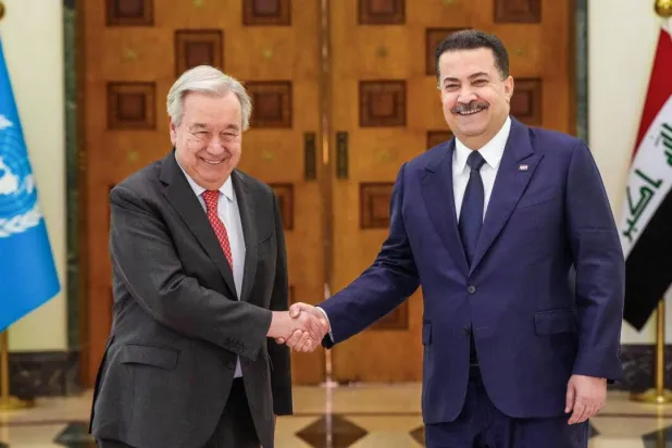 This handout picture released by the office of Iraq's Prime Minister Mohammed Shia al-Sudani shows him shaking hands with United Nations Secretary-General Antonio Guterres during a meeting in Baghdad. (Handout / Iraqi Prime Minister’s Press Office/AFP) 