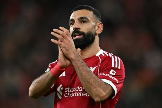 Liverpool's Egyptian striker #11 Mohamed Salah applauds the fans following the English Premier League football match between Liverpool and Brighton and Hove Albion at Anfield in Liverpool, north west England on December 13, 2025. (AFP)
