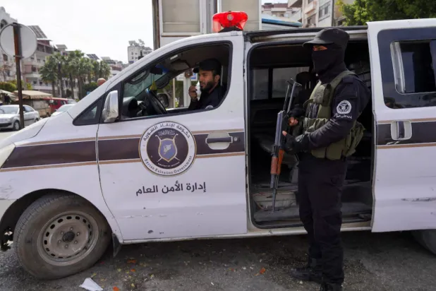 Members of the Syrian security forces secure an area -REUTERS/Karam al-Masri