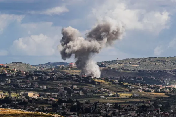 Smoke rises above Lebanon, following an Israeli strike, amid ongoing cross-border hostilities between Hezbollah and Israeli forces, as seen from Israel's border with Lebanon in northern Israel, May 5, 2024. REUTERS/Ayal Margolin /File Photo 