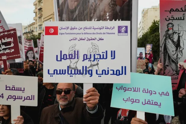 Activists and political opponents take part in a protest against Tunisian President Kais Saied, calling for an end to one-man rule and the restoration of democracy, in Tunis, Tunisia, December 13, 2025. REUTERS/Jihed Abidellaoui