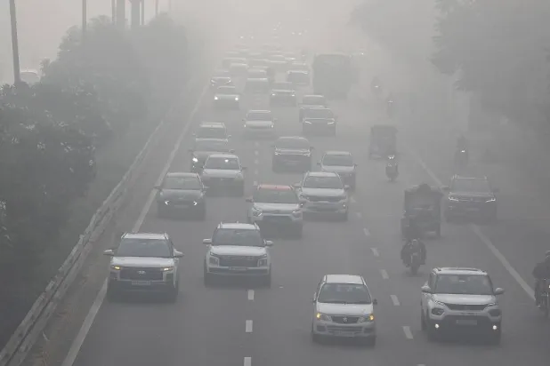 Vehicles move on a road amid heavy smog near New Delhi, India, 15 December 2025. (EPA)