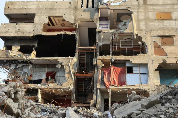 A general view of a residential building damaged during the war, in Gaza City, December 14, 2025. REUTERS/Dawoud Abu Alkas 