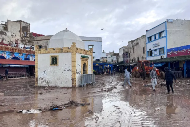 People inspect the damage caused by flash floods in Safi, Morocco, Monday, Dec. 15, 2025. (AP Photo/Abderrazak Gouach)