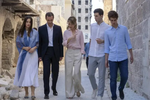 Bashar al-Assad with his wife, Asma, walk with their children in the northern Syrian city of Aleppo in 2022. (Former Syrian presidency Facebook page/AFP/Getty Images) 