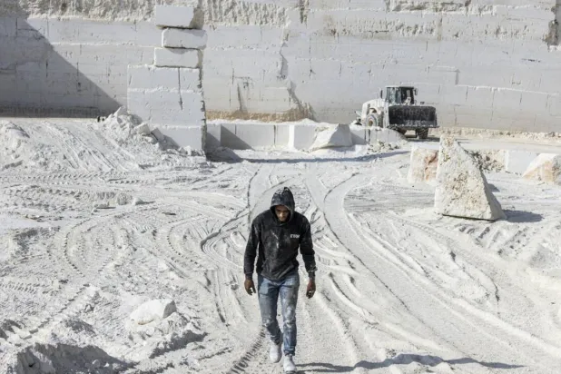 Quarry work in the occupied West Bank is tough, but there are few other options available in the territory's wilting economy. JOHN WESSELS / AFP
