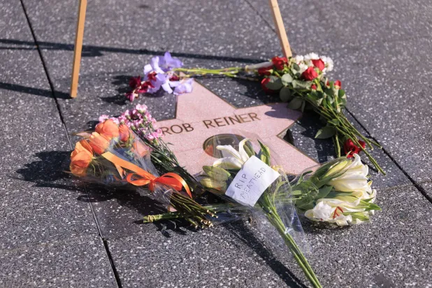 15 December 2025, US, Los Angeles: A wreath of flowers is placed on US director Rob Reiner's Star on the Hollywood Walk of Fame. (dpa)