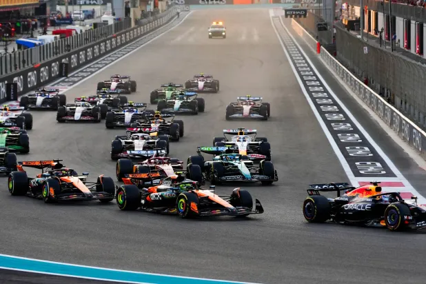12 July 2025, United Arab Emirates, Abu Dhabi: Red Bull driver Max Verstappen leads into turn one during the Abu Dhabi Grand Prix at the Yas Marina Circuit, Abu Dhabi. (dpa)