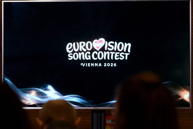 A screen shows the logo of the Eurovision Song Contest (ESC) 2026 during a press conference of Austrian national public broadcaster ORF in Vienna on December 16, 2025. (AFP)