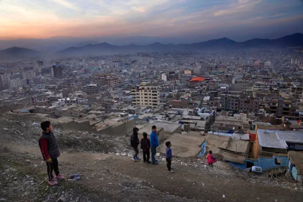 Boys stay on a hilltop overlooking Kabul, Afghanistan, Feb. 27, 2022. (AP)
