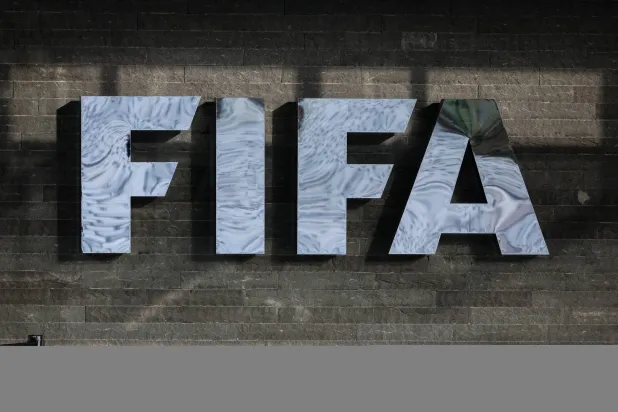 13 December 2024, Switzerland, Zurich: The FIFA logo is seen on the façade of FIFA headquarters before the draw ceremony for the 2026 FIFA World Cup qualifiers. (dpa)