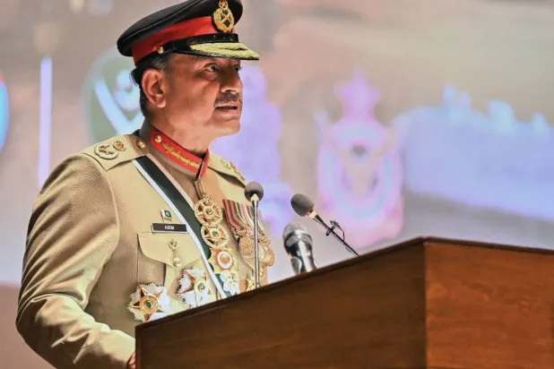 In this photo released by the Inter Services Public Relations, Pakistan's Chief of Defense Forces and Army Chief Gen. Asim Munir speaks during a ceremony at the joint military command headquarters in Rawalpindi, Pakistan, Monday, Dec. 8, 2025. (Inter Services Public Relations via AP)