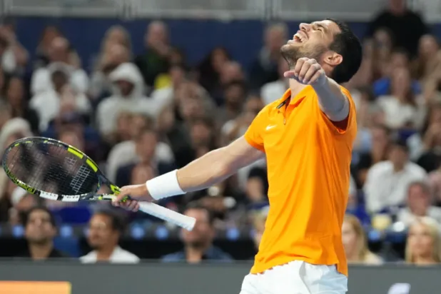 Carlos Alcaraz reacts after winning the first set against Joao Fonseca during the Miami Tennis Invitational tournament, Monday, Dec. 8, 2025, in Miami. (AP Photo/Lynne Sladky)


