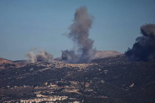 TOPSHOT - Smoke rises from the site of a series of Israeli airstrikes that targeted the outskirts of the southern Lebanese village of al-Katrani on December 18, 2025.  (Photo by Rabih DAHER / AFP)
