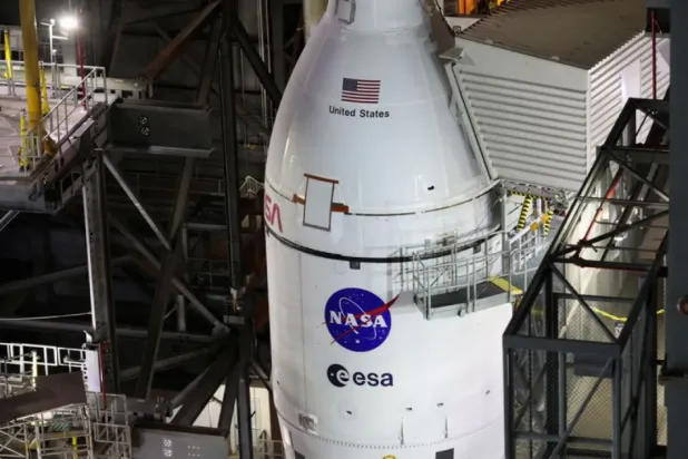 NASA's next-generation moon rocket, the Space Launch System (SLS) rocket with its Orion crew capsule perched on top, is seen in the Vehicle Assembly Building (VAB) before it is scheduled to make a slow-motion journey to its launch pad at Cape Canaveral, Florida, US March 16, 2022. REUTERS/Thom Baur