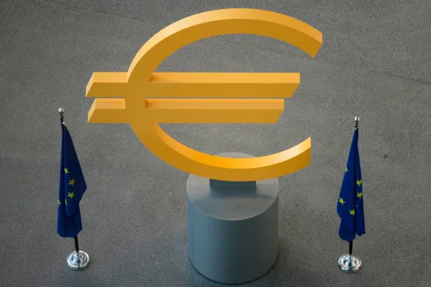 The Euro currency symbol is seen prior to a press conference after an ECB's governing council meeting in Frankfurt, Germany, Thursday, Dec. 18, 2025. (AP Photo/Michael Probst)