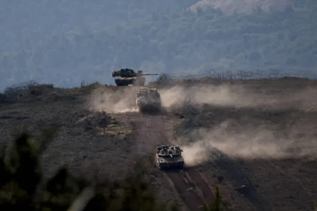 FILE PHOTO: Lebanese army members stand on a military vehicle during a Lebanese army media tour, to review the army's operations in the southern Litani sector, in Alma Al-Shaab, near the border with Israel, southern Lebanon, November 28, 2025. REUTERS/Aziz Taher/File Photo