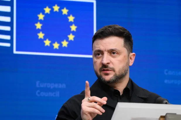 Ukraine's President Volodymyr Zelensky speaks during a press conference as part of the European Council meeting in Brussels on December 18, 2025. European Unions leaders meet in Brussels on December 18 and 19, 2025, to discuss in particular the need to support Ukraine, transatlantic relations and the EU's strategic autonomy. (Photo by JOHN THYS / AFP)