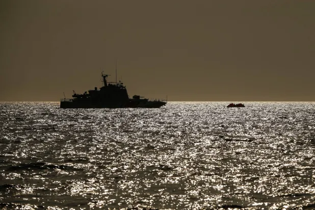 FILE - In this Saturday, Sept. 12, 2020 file photo, a Turkish coast guard vessel approaches a life raft with migrants in the Aegean Sea, between Türkiye and Greece.   (AP Photo/Emrah Gurel, File)