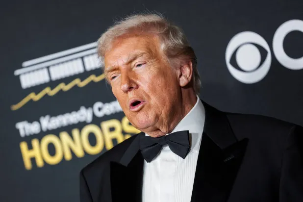 FILE PHOTO: US President Donald Trump poses on the red carpet for the 2025 Kennedy Center Honors at the John F. Kennedy Center for the Performing Arts in Washington, D.C., US, December 7, 2025. REUTERS/Jeenah Moon/File Photo
