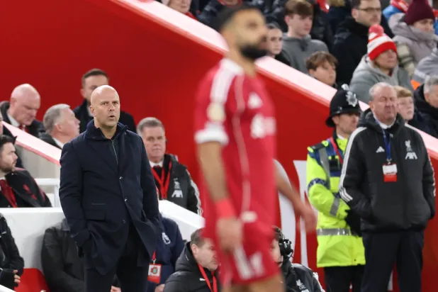 Liverpool manager Arne Slot (L) looks on towards Mohamed Salah of Liverpool (R) during the English Premier League match between Liverpool FC and Brighton & Hove Albion, in Liverpool, Britain, 13 December 2025. EPA/ADAM VAUGHAN 