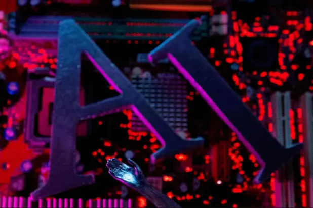 AI (Artificial Intelligence) letters and robot hand are placed on computer motherboard in this illustration created on June 23, 2023. REUTERS/Dado Ruvic/Illustration/File Photo
