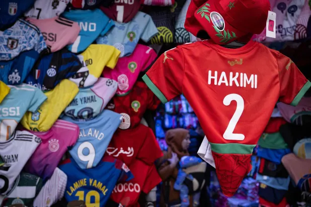 Morocco defender Achraf Hakimi's jersey is displayed in a shop in Rabat, on December 19, 2025, ahead of the Africa Cup of Nations (AFCON). 2 ACHRAF HAKIMI (Photo by SEBASTIEN BOZON / AFP)