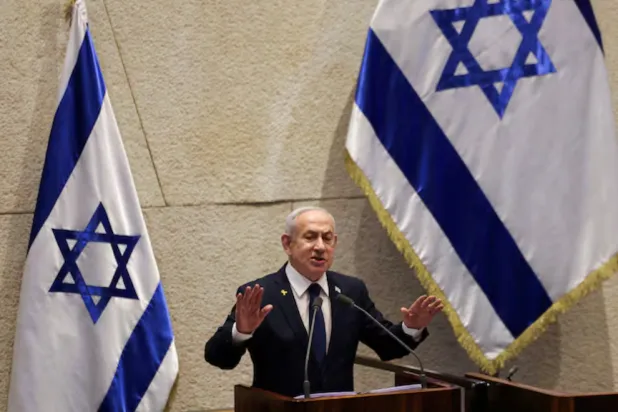 Israeli Prime Minister Benjamin Netanyahu speaks at the plenum of the Knesset, Israel's parliament, in Jerusalem, November 10, 2025. REUTERS/Ronen Zvulun/File Photo 
