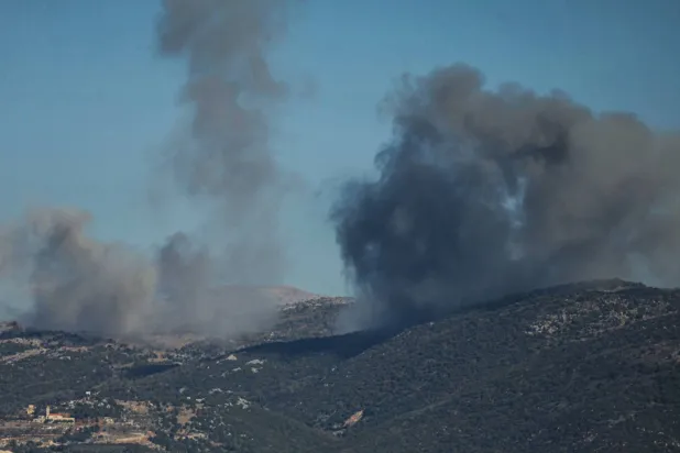 Smoke rises from the site of a series of Israeli airstrikes that targeted the outskirts of the southern Lebanese village of al-Katrani on December 18, 2025. (AFP)