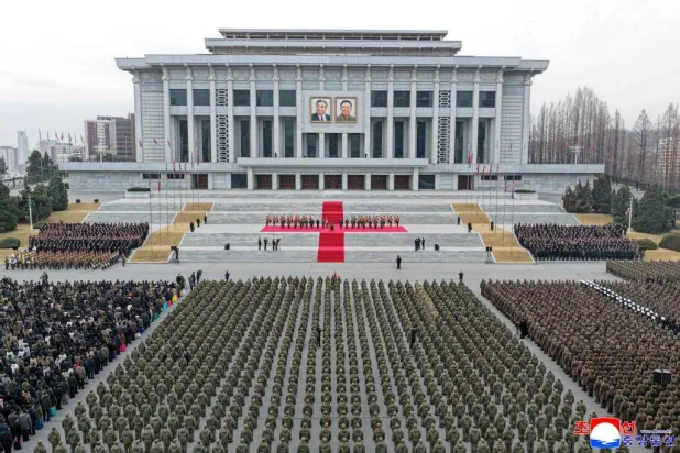 This picture taken on December 12, 2025 and released from North Korea's official Korean Central News Agency (KCNA) on December 13 shows North Korean leader Kim Jong Un (at podium) attending a welcoming ceremony for the Korean People's Army's 528th Regiment of Engineers, which returned from an overseas deployment in Russia's Kursk region during Moscow's war with Ukraine, in front of the April 25 House of Culture in Pyongyang. (KCNA VIA KNS / AFP) 