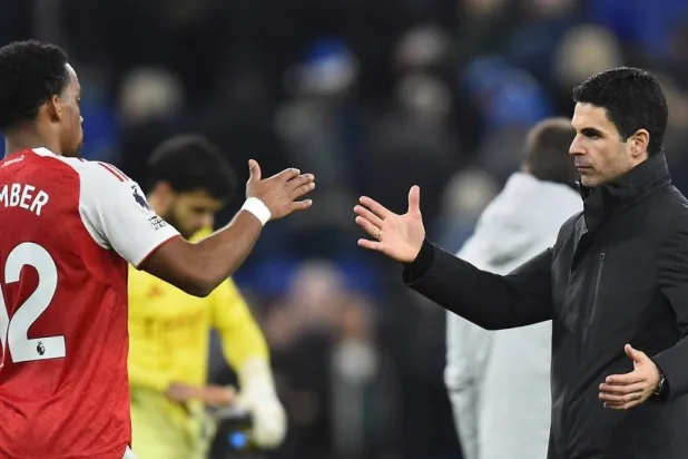 Arsenal's manager Mikel Arteta (R) and Arsenal's Jurrien Timber (L) react after the English Premier League match between Everton FC and Arsenal FC, at the Hill Dickinson Stadium in Liverpool, Britain, 20 December 2025. (EPA)
