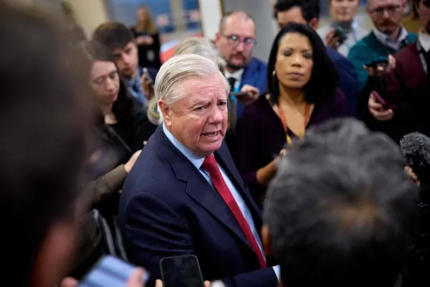 Sen. Lindsey Graham (R-SC) speaks to reporters after Secretary of War Pete Hegseth and Secretary of State Marco Rubio attend closed door meetings with lawmakers on Capitol Hill on December 16, 2025 in Washington, DC. (Getty Images via AFP) 