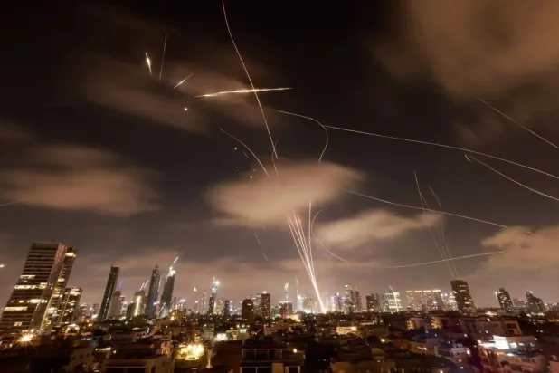 Israeli defenses intercept Iranian missiles over Tel Aviv on June 22. (AFP) 