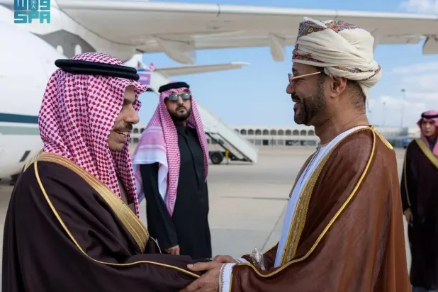 Omani FM Sayyid Badr bin Hamad bin Hamood Albusaidi welcomes his Saudi counterpart Prince Faisal bin Farhan bin Abdullah upon his arrival in Muscat. (SPA)