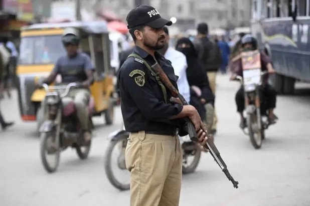 File photo: Police officers stand guard to secure a procession during the mourning month of Muharram in Karachi, Pakistan, 03 July 2025. EPA/SHAHZAIB AKBER
