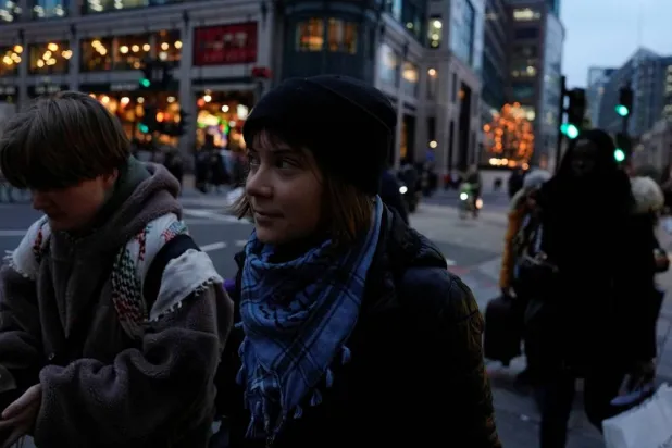 Swedish activist Greta Thunberg walks out of City of London Police station after being arrested by police this morning at a pro‑Palestinian protest, in London, Britain, December 23, 2025. (Reuters) 