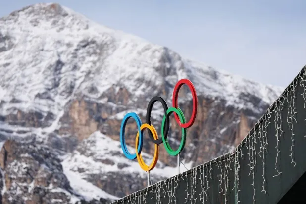 A general view shows the Olympic rings on the Cortina Curling Olympic Stadium, which will host the curling, wheelchair curling, and Paralympic closing ceremony during the Milano Cortina Winter Olympic Games 2026, in Cortina, Italy, January 25, 2025. (Reuters)