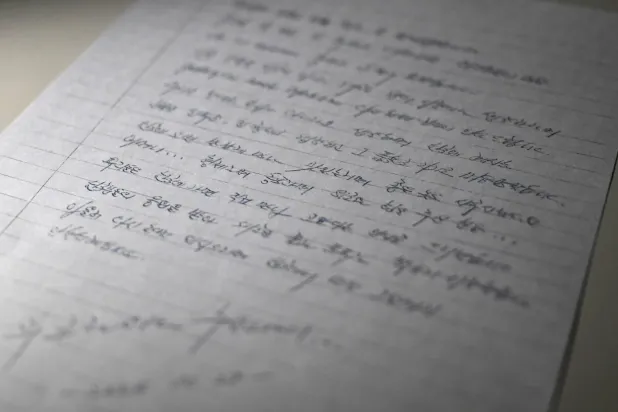 This photo illustration taken in Seoul on December 24, 2025 shows a copy of a letter written on October 28, 2025 by North Korean prisoners of war in Ukraine. (AFP)