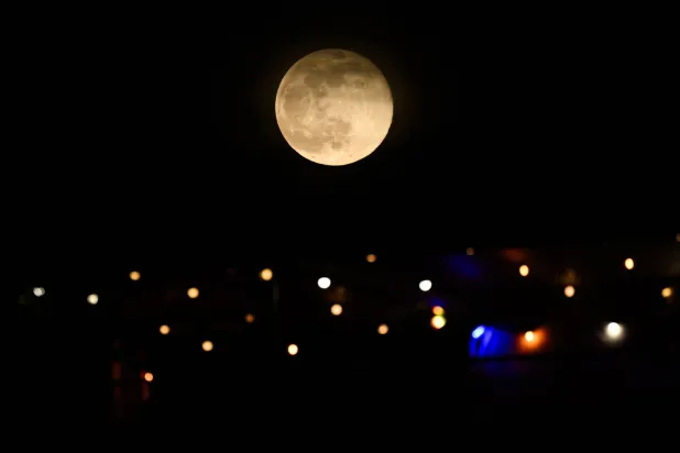 November's full moon, also known as Beaver Moon, rises over Fort-de-France in the French overseas island of Martinique, on November 5, 2025. (AFP)
