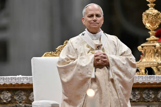  Pope Leo XIV arrives looks on as he performs the Christmas mass at St Peter's Basilica in the Vatican on December 25, 2025. (AFP) 